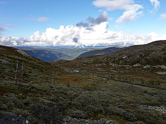 Scenic Norwegian Mountain Landscape with Clouds and Valley