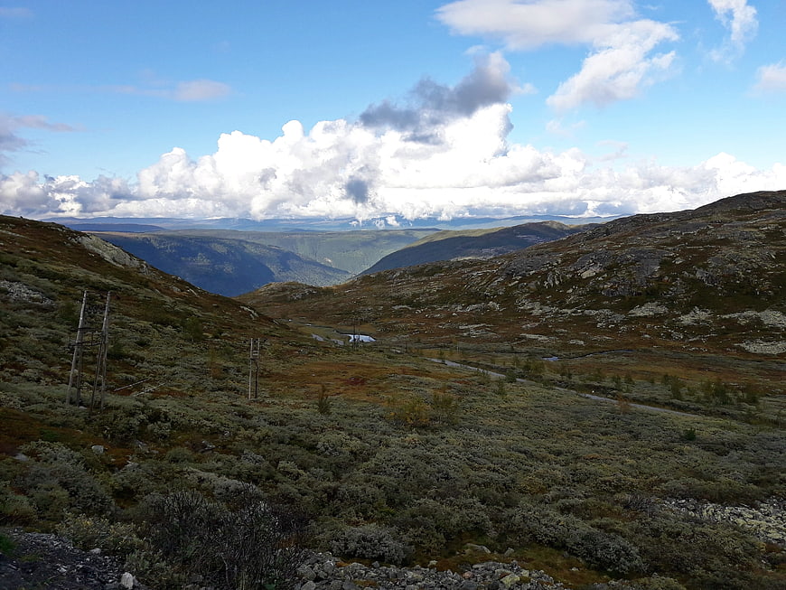 Scenic Norwegian Mountain Landscape with Clouds and Valley