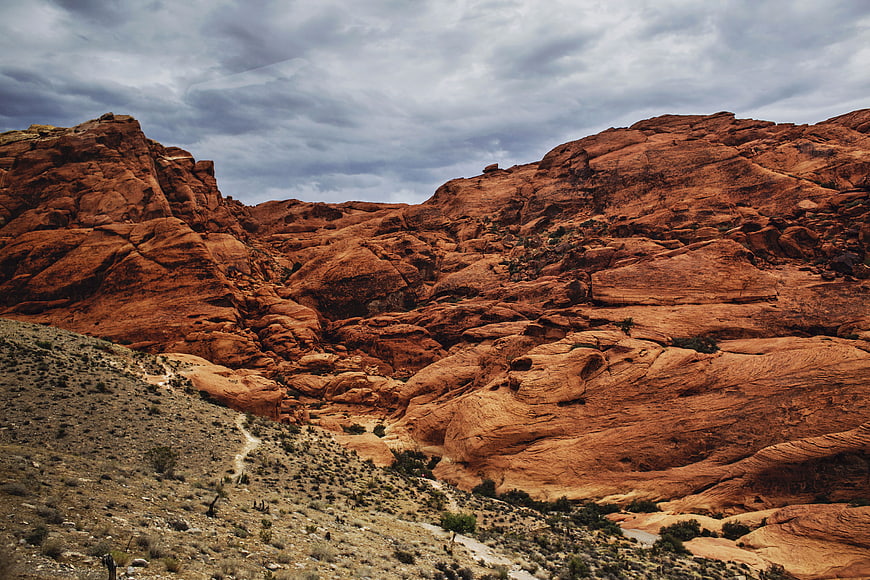 Dramatic Red Rock Desert Landscape with Cloudy Sky