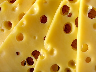 Close-up of Swiss cheese slices with holes