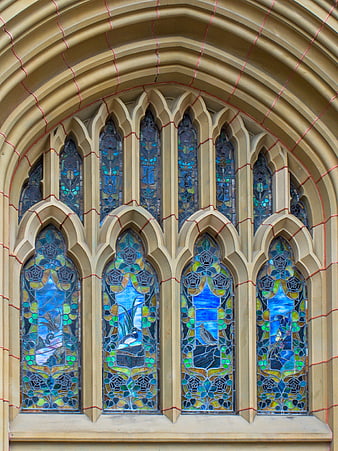 Gothic Stained Glass Window with Blue and Green Floral Patterns