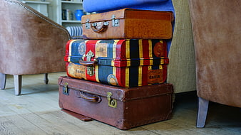 Stack of vintage suitcases in a cozy living room interior