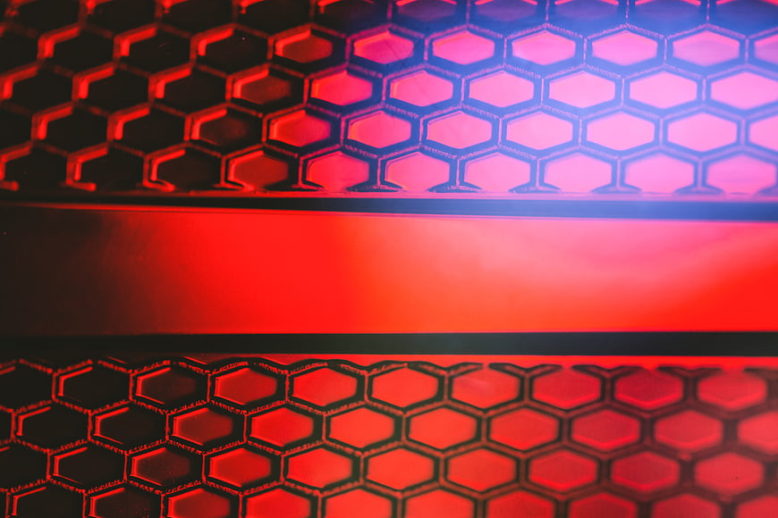 Red and Blue Hexagonal Automotive Grille Texture