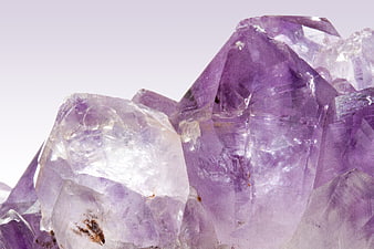 Close-up of purple amethyst crystal cluster with natural inclusions