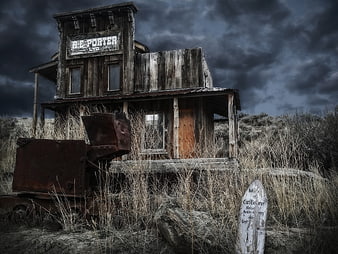 Abandoned R.E. Porter Building in Desolate Ghost Town Landscape