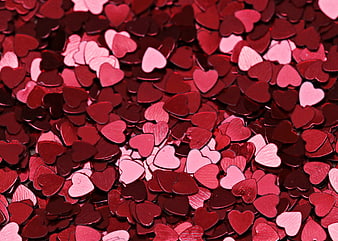 Red and Pink Heart Shaped Confetti Texture Background