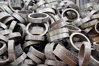 Pile of rusty metal rings industrial background
