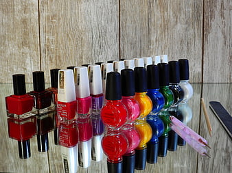 Colorful Nail Polish Collection On Mirror Surface
