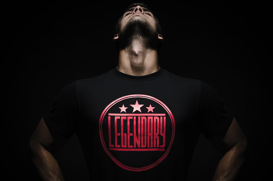 Bearded Man Wearing Black T-Shirt With Red Legendary Logo