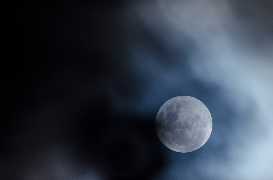 Full Moon in Dark Blue Cloudy Night Sky