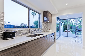 Modern Kitchen Interior With Wood Cabinets And Large Windows