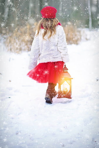 Little Girl in Red Walking in Snow with Lantern