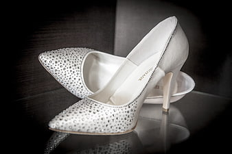 White Rhinestone Wedding Heels on Reflective Surface