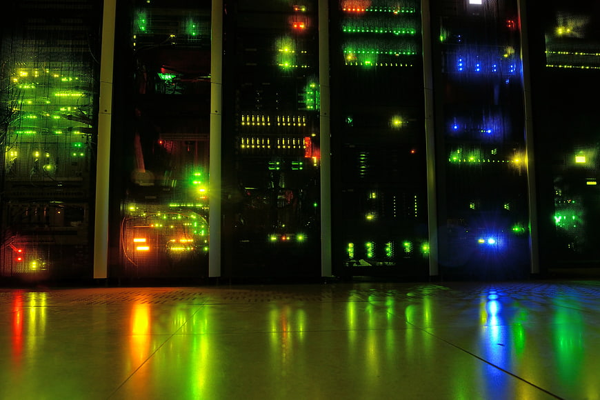 Illuminated Server Racks In Dark Data Center With Colorful LED Lights