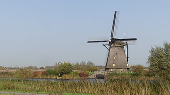 Traditional Dutch Windmill in Kinderdijk Landscape