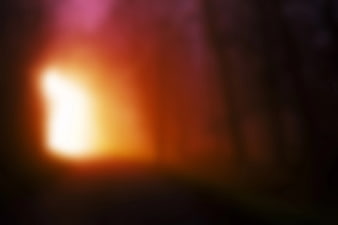 Abstract Blurred Bokeh Background with Warm Orange and Red Light