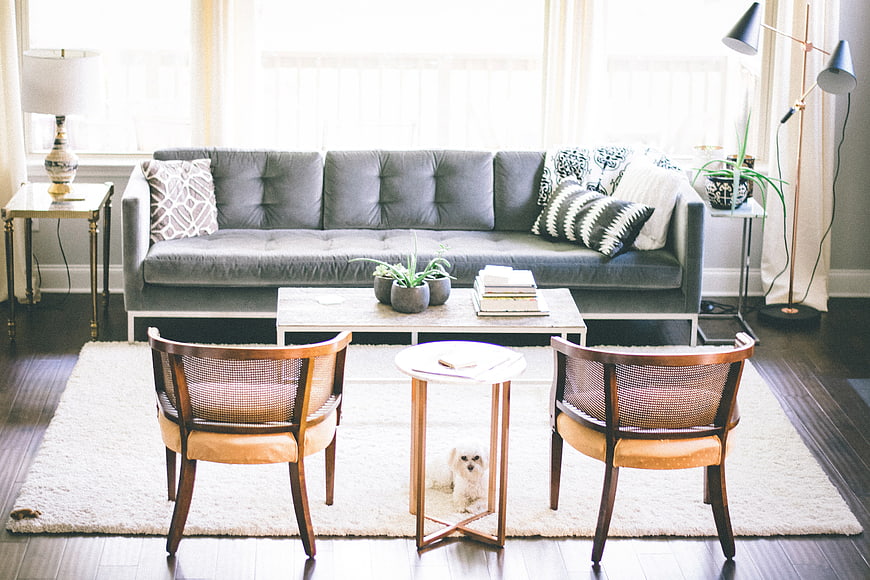 Modern Living Room with Gray Sofa and Wooden Chairs