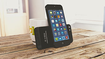 Black Smartphone Docked in Stand on Rustic Wooden Table