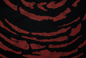 Red and black woven fabric texture close up