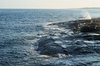 Ocean Waves Crashing on Rocky Coastal Shoreline
