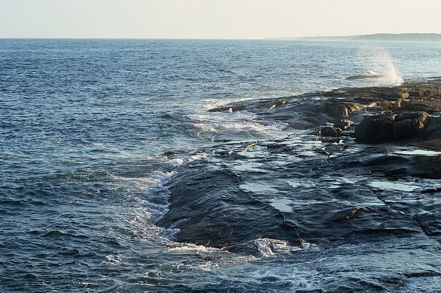 Ocean Waves Crashing on Rocky Coastal Shoreline