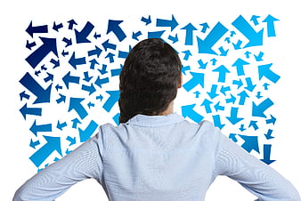 Woman facing chaotic blue arrows on white background
