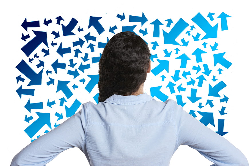 Woman facing chaotic blue arrows on white background