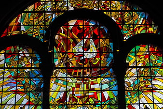 Vibrant Stained Glass Church Window With Religious Figures