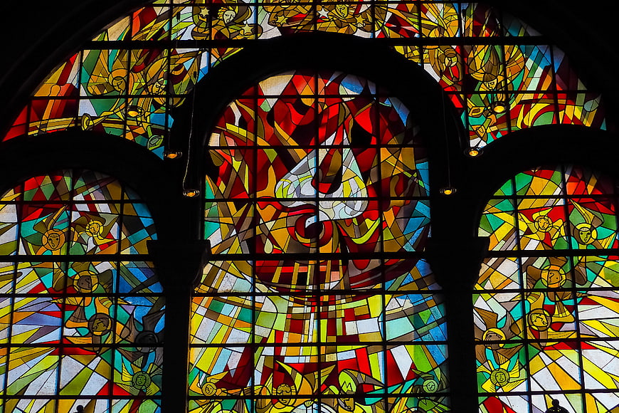Vibrant Stained Glass Church Window With Religious Figures