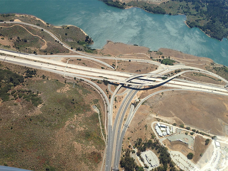 Aerial view of highway interchange near lake