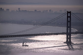 Silhouette of Golden Gate Bridge with Sailboat in San Francisco