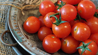 Fresh Red Cocktail Tomatoes In Rustic Metal Bowl