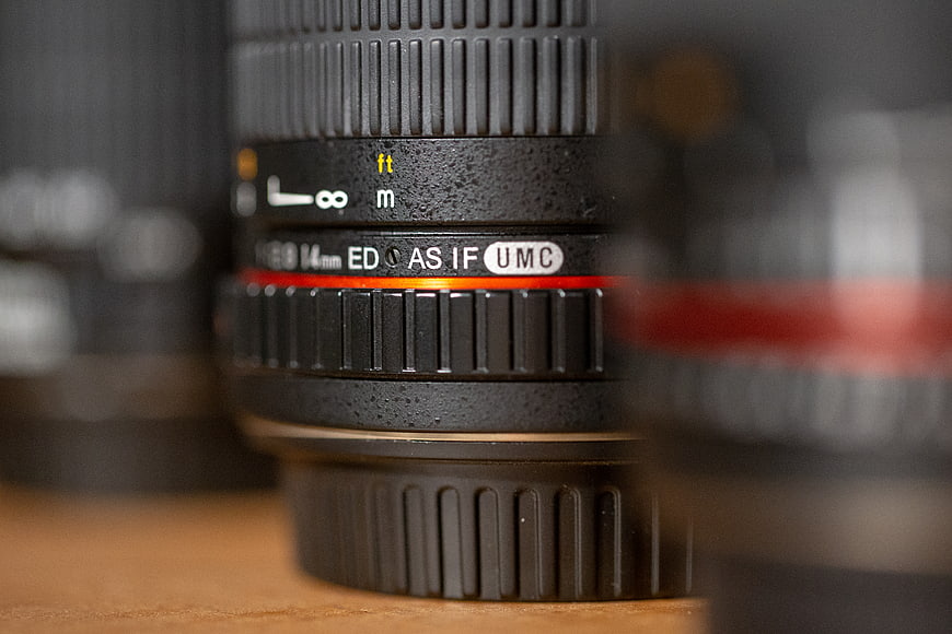 Close-up of Professional Camera Lens with Red Ring