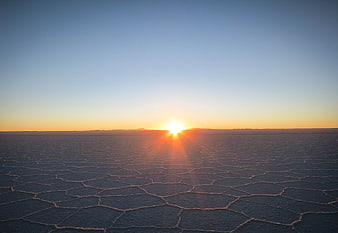 Sunset over hexagonal salt flats in the Atacama Desert, Chile