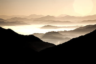 Misty Mountain Landscape at Sunrise with Sea of Fog
