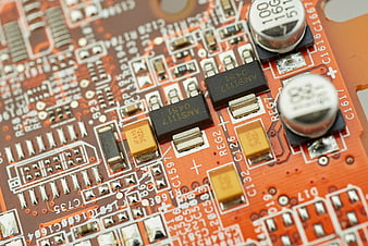 Macro Close-Up of Orange Printed Circuit Board Components