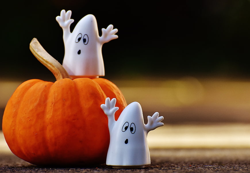 Cute Halloween Ghosts on Pumpkin with Bokeh Background