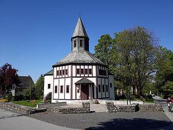 Historic octagonal church with timber framing and spire