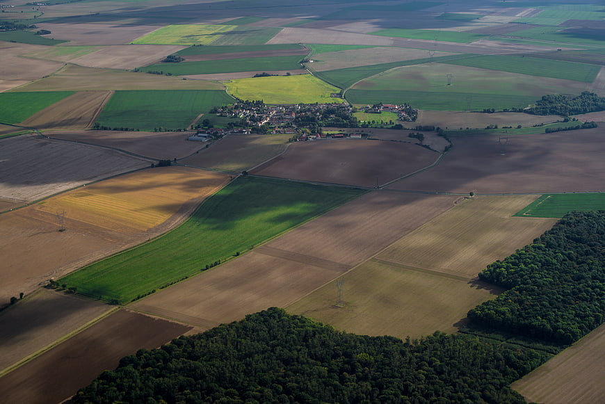 Aerial View of Patchwork Farmland and Village