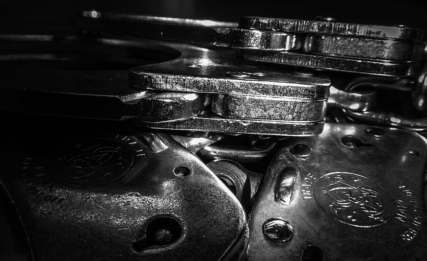 Close-up of metal handcuffs in black and white