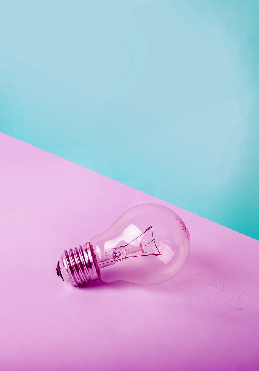 Clear Light Bulb on Pink and Blue Background