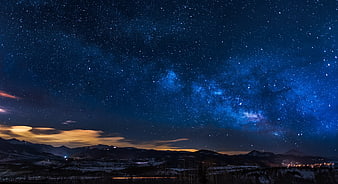 Milky Way Galaxy Over Snowy Mountain Landscape at Night