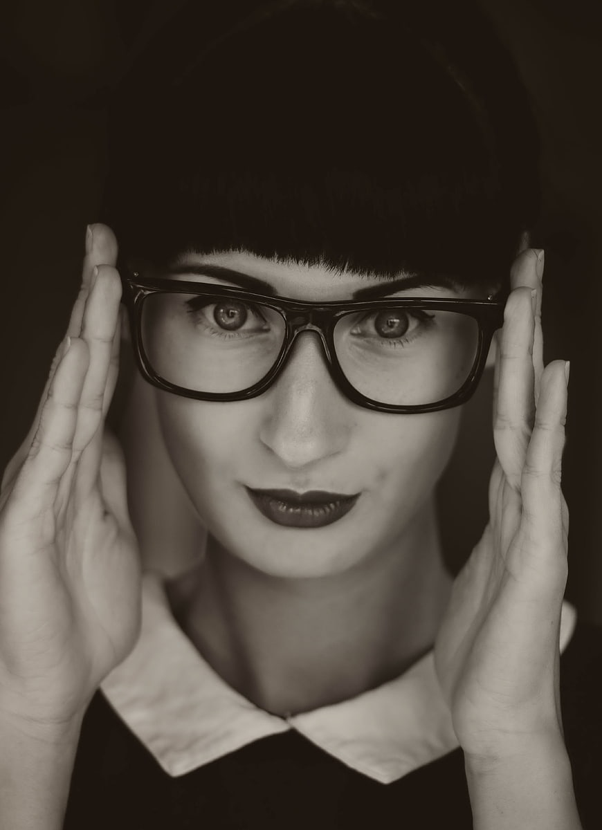 Vintage Black and White Portrait of Woman with Glasses