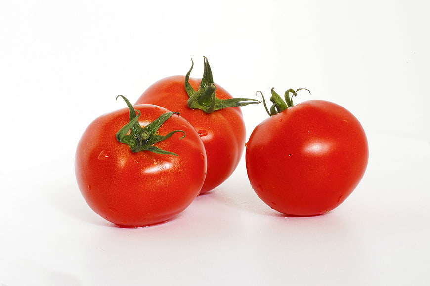 Three Fresh Red Tomatoes on White Background