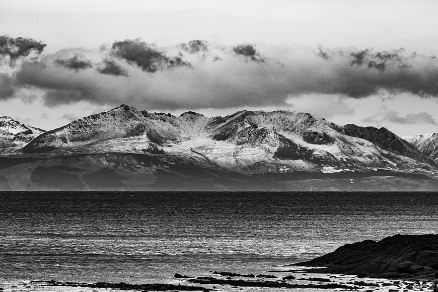 Dramatic Black and White Snowy Mountain Landscape by the Sea