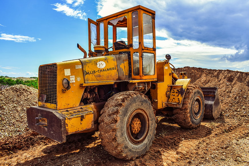 Vintage Yellow Allis-Chalmers Front Loader on Construction Site