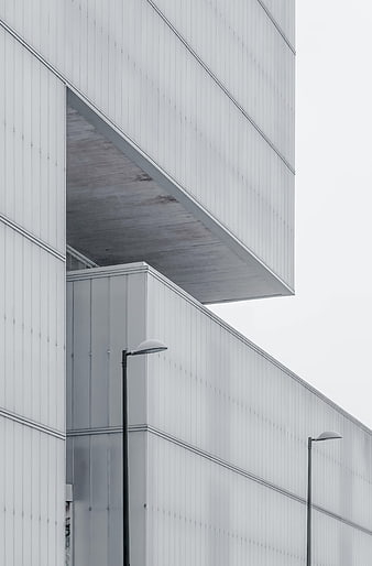 Minimalist modern architecture with white facade and street lamps
