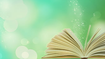 Open book with magical sparkles and green bokeh background