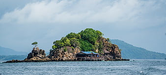 Tropical Island Landscape With Rocky Coastline And Wooden Pier