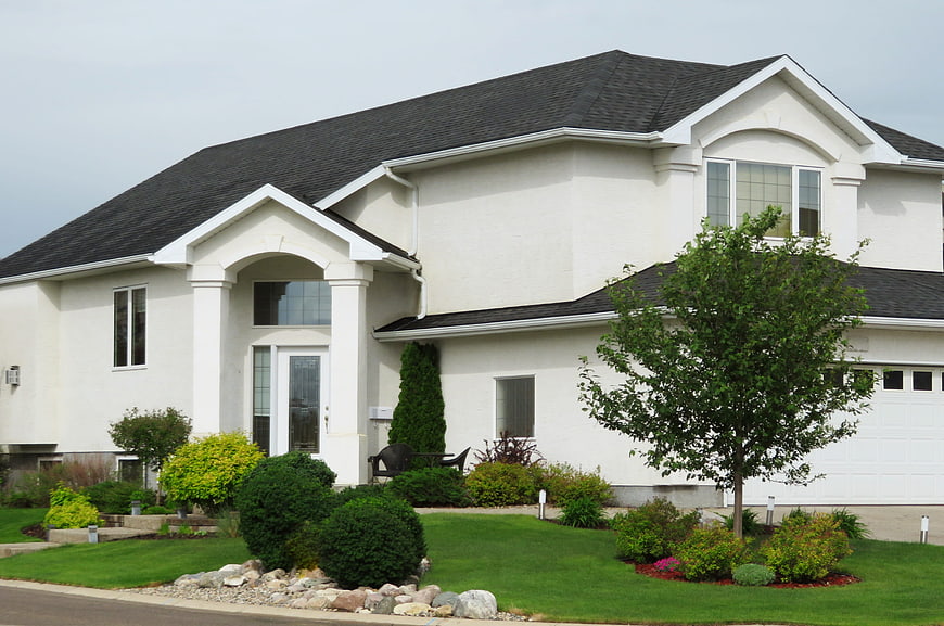 Modern White Two-Story House with Landscaped Front Yard